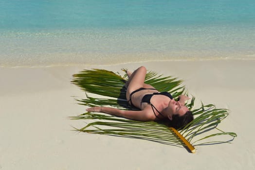 happy young woman on summer vacation on beautiful tropical beach have fun enjoy and relax