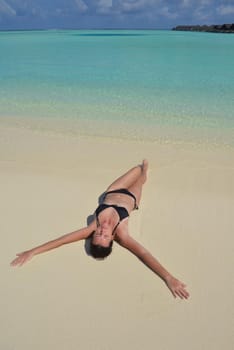 happy young woman on summer vacation on beautiful tropical beach have fun enjoy and relax