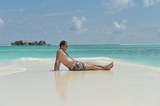 beautiful and happy young woman on beach have fun and relax on summer vacation  over the crystal clear sea