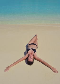 happy young woman on summer vacation on beautiful tropical beach have fun enjoy and relax