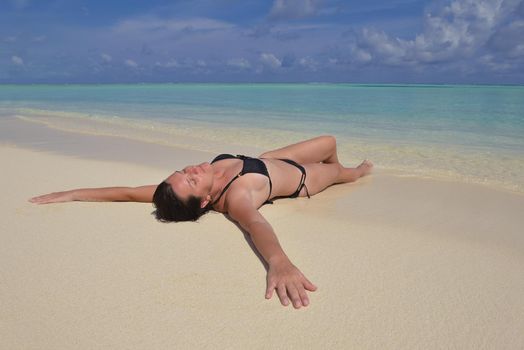 happy young woman on summer vacation on beautiful tropical beach have fun enjoy and relax