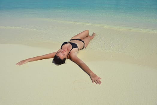 happy young woman on summer vacation on beautiful tropical beach have fun enjoy and relax