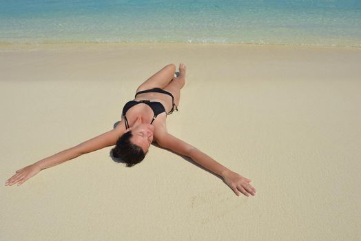 happy young woman on summer vacation on beautiful tropical beach have fun enjoy and relax