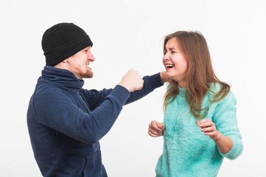 Woman victim of violence and abuse. Criminal man beats a woman.