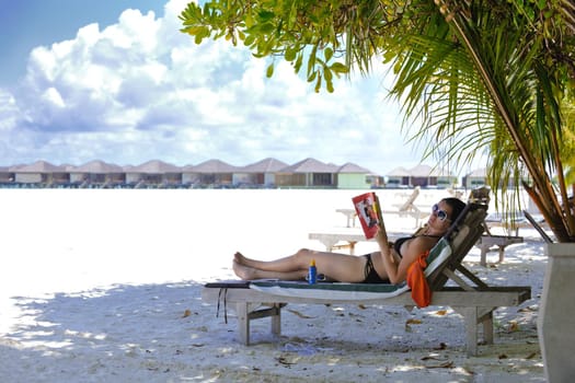 happy young woman on summer vacation on beautiful tropical beach have fun enjoy and relax