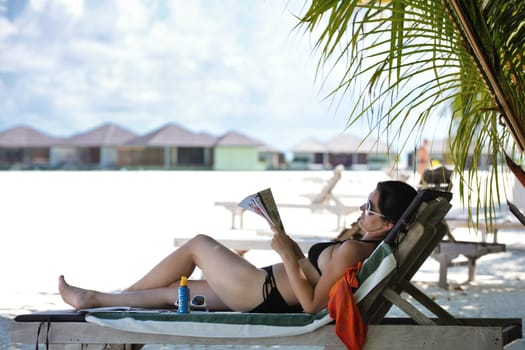 happy young woman on summer vacation on beautiful tropical beach have fun enjoy and relax