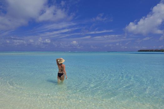 happy young woman on summer vacation on beautiful tropical beach have fun and relax