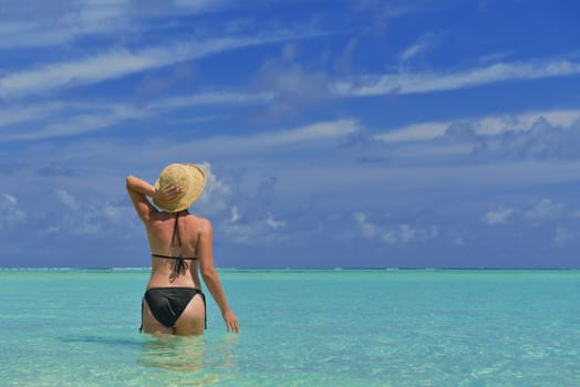 happy young woman on summer vacation on beautiful tropical beach have fun enjoy and relax