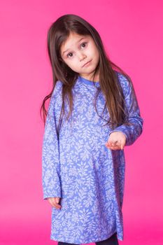 Pretty cute little girl on pink background