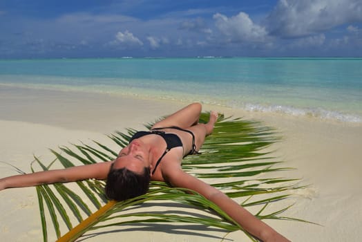 happy young woman on summer vacation on beautiful tropical beach have fun enjoy and relax