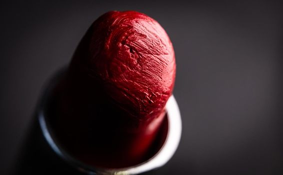 Beautiful red lipstick on black background