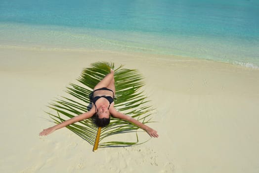 happy young woman on summer vacation on beautiful tropical beach have fun enjoy and relax