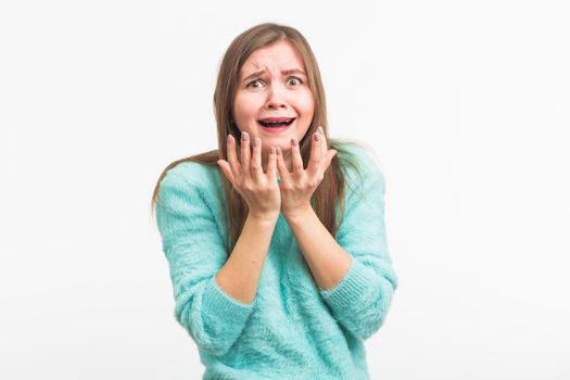 A sad beautiful woman crying on white background