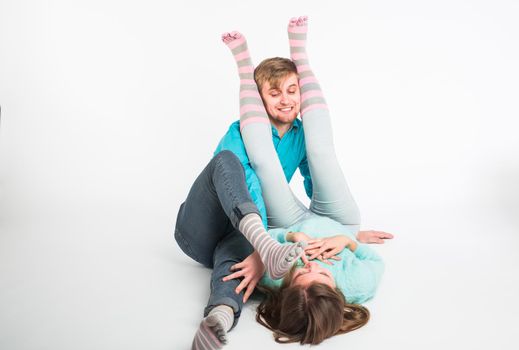 Happy couple having fun and fooling around. Joyful man and woman have nice time. Good relationship and valentines day concept.