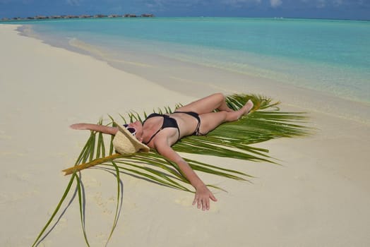 happy young woman on summer vacation on beautiful tropical beach have fun enjoy and relax