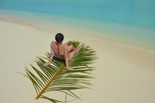 happy young woman on summer vacation on beautiful tropical beach have fun enjoy and relax