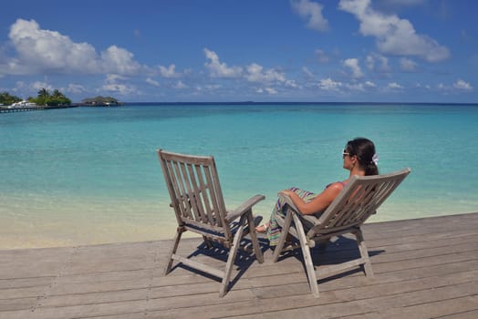 happy young woman on summer vacation on beautiful tropical beach have fun enjoy and relax