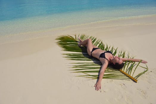 happy young woman on summer vacation on beautiful tropical beach have fun and relax