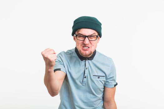 portrait of young angry man on white background.