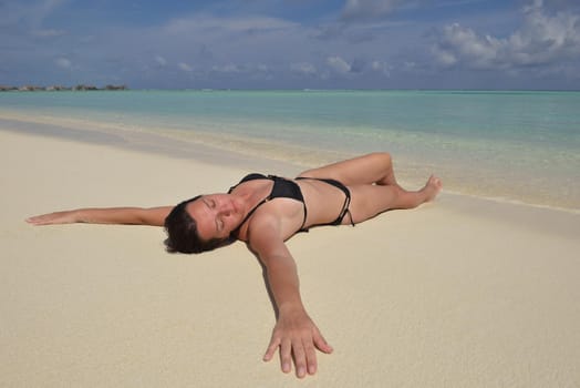 happy young woman on summer vacation on beautiful tropical beach have fun enjoy and relax