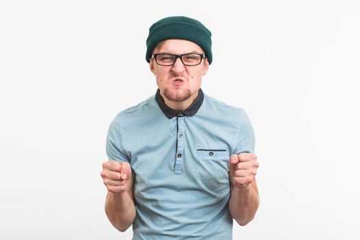 portrait of young angry man on white background.