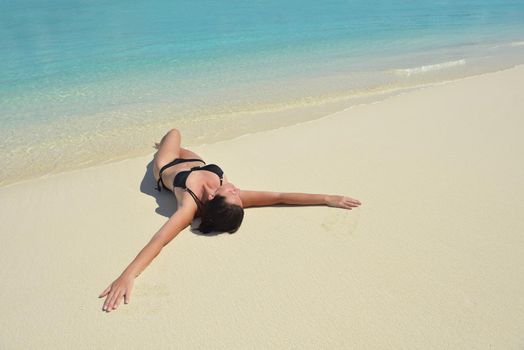 happy young woman on summer vacation on beautiful tropical beach have fun enjoy and relax