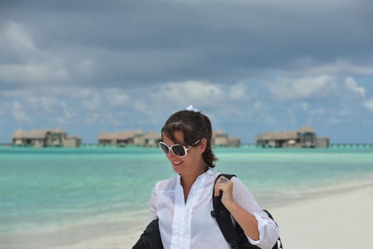 happy young woman on summer vacation on beautiful tropical beach have fun enjoy and relax