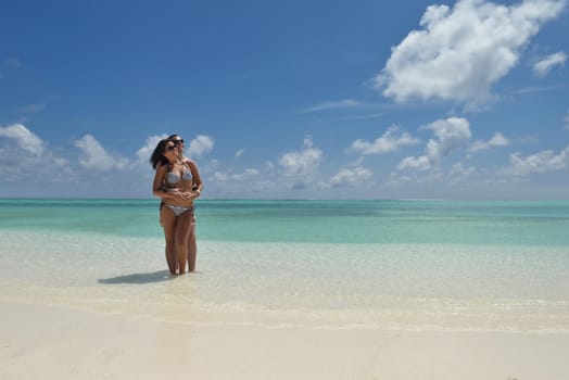 happy young romantic couple in love have fun and relaxing on beautiful beach