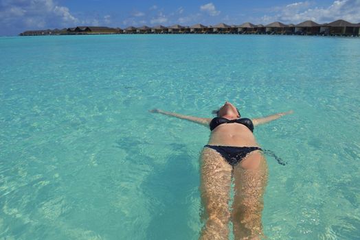 happy young woman on summer vacation on beautiful tropical beach have fun enjoy and relax