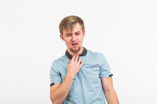 Sore throat. Men touching the neck. Sick guy isolated