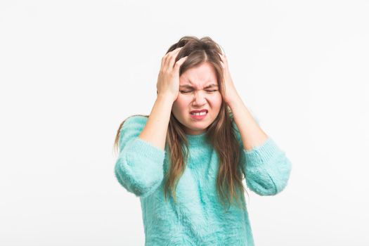 Concerned scared woman on white background in studio