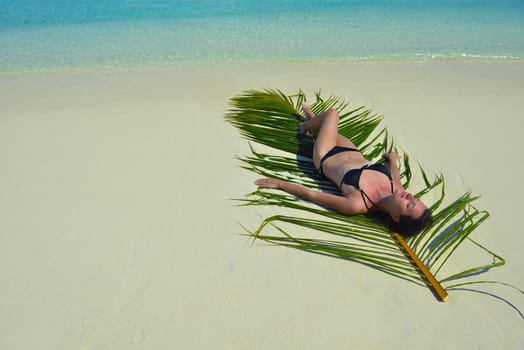 happy young woman on summer vacation on beautiful tropical beach have fun enjoy and relax