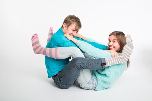 Happy couple having fun and fooling around. Joyful man and woman have nice time. Good relationship and valentines day concept.