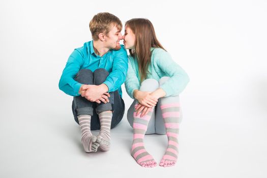 Portrait funny moments of excited couple fooling around to camera on white background. Having fun, weekends and valentines day concept.