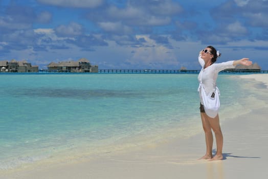 happy young woman on summer vacation on beautiful tropical beach have fun enjoy and relax