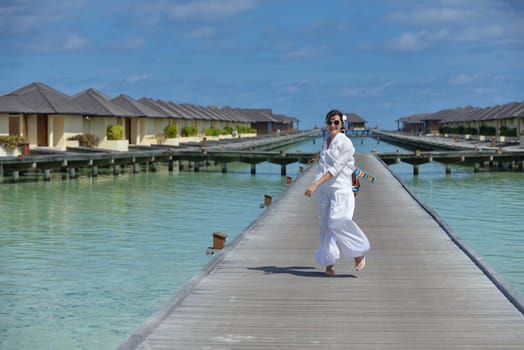 happy young woman on summer vacation on beautiful tropical beach have fun enjoy and relax