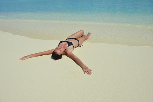 happy young woman on summer vacation on beautiful tropical beach have fun enjoy and relax