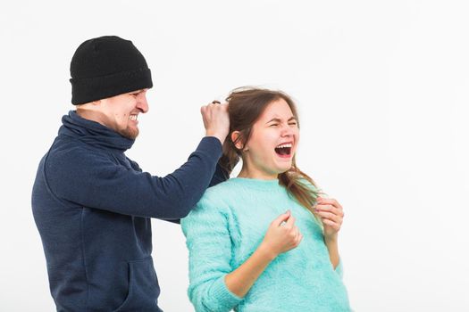 Woman victim of violence and abuse. Criminal man beats a woman.