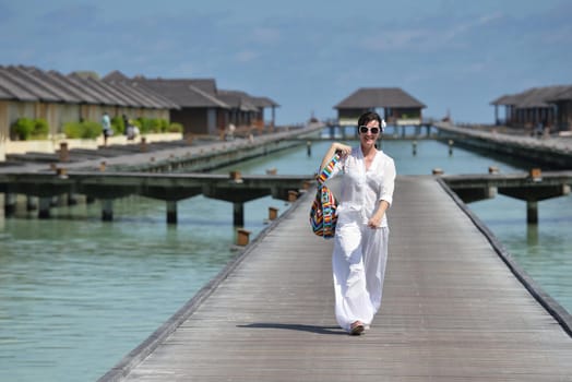 happy young woman on summer vacation on beautiful tropical beach have fun enjoy and relax