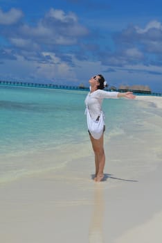 happy young woman on summer vacation on beautiful tropical beach have fun enjoy and relax