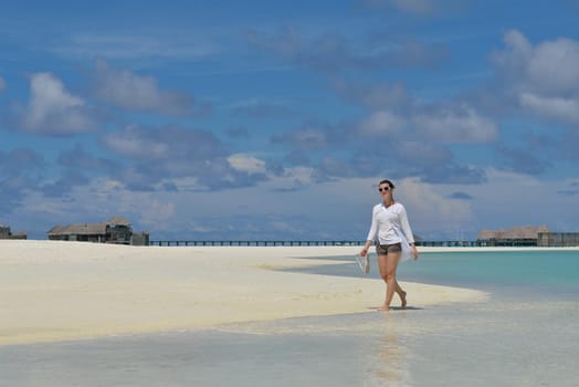 happy young woman on summer vacation on beautiful tropical beach have fun enjoy and relax