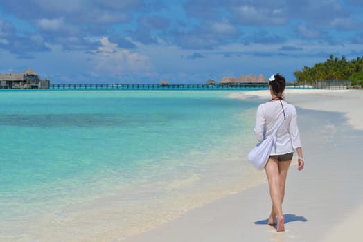 happy young woman on summer vacation on beautiful tropical beach have fun and relax