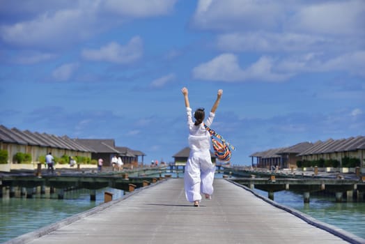 happy young woman on summer vacation on beautiful tropical beach have fun and relax