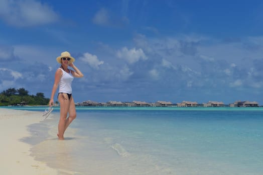 happy young woman on summer vacation on beautiful tropical beach have fun and relax