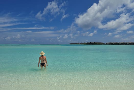 happy young woman on summer vacation on beautiful tropical beach have fun enjoy and relax