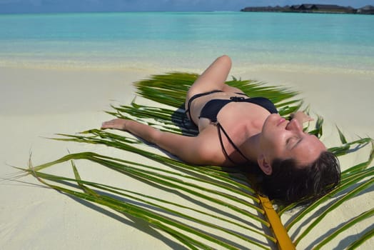 happy young woman on summer vacation on beautiful tropical beach have fun enjoy and relax