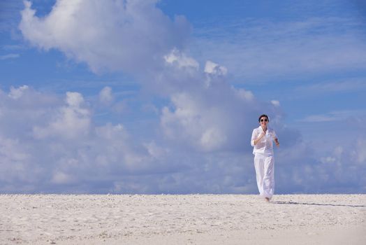 happy young woman on summer vacation on beautiful tropical beach have fun enjoy and relax