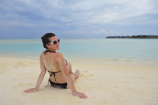 happy young woman on summer vacation on beautiful tropical beach have fun enjoy and relax