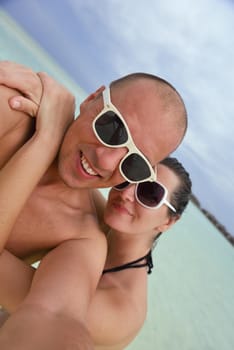 happy young romantic couple in love have fun running and relaxing on beautiful beach