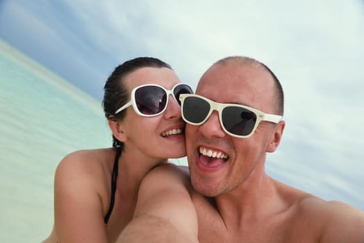 happy young romantic couple in love have fun running and relaxing on beautiful beach